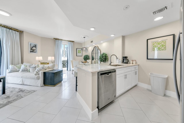 kitchen featuring sink, dishwasher, pendant lighting, white cabinets, and light stone counters