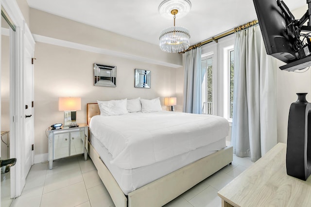 tiled bedroom featuring an inviting chandelier