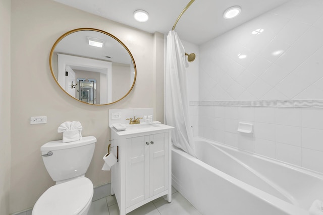 full bathroom with vanity, toilet, shower / bath combo with shower curtain, and tile patterned flooring