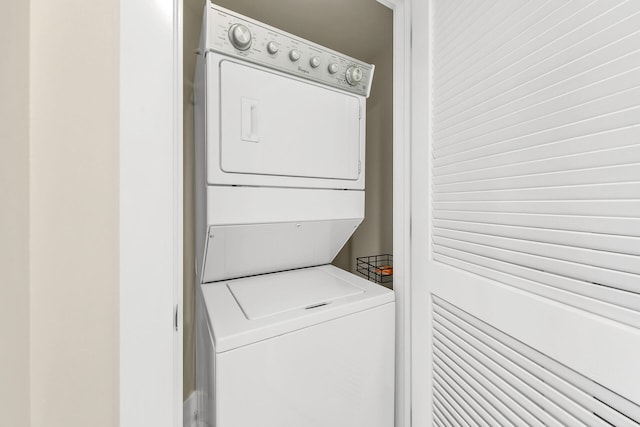 washroom with stacked washer and dryer