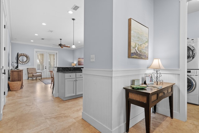 2452 Bungalo Ln, Miramar Beach, FL 32550 - hallway with stacked washer / drying machine, crown molding, wainscoting, and recessed lighting