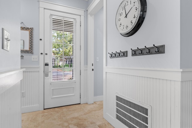 2452 Bungalo Ln, Miramar Beach, FL 32550 - entryway with a wainscoted wall, a decorative wall, and tile patterned floors