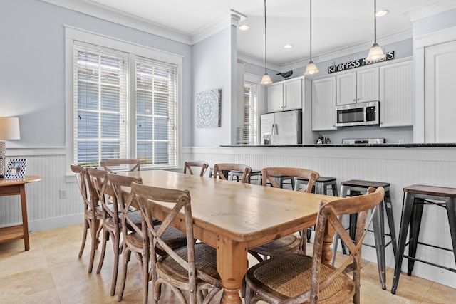 2452 Bungalo Ln, Miramar Beach, FL 32550 - dining space with ornamental molding, light tile patterned floors, a wainscoted wall, a decorative wall, and recessed lighting