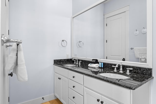 bathroom with vanity and tile patterned flooring