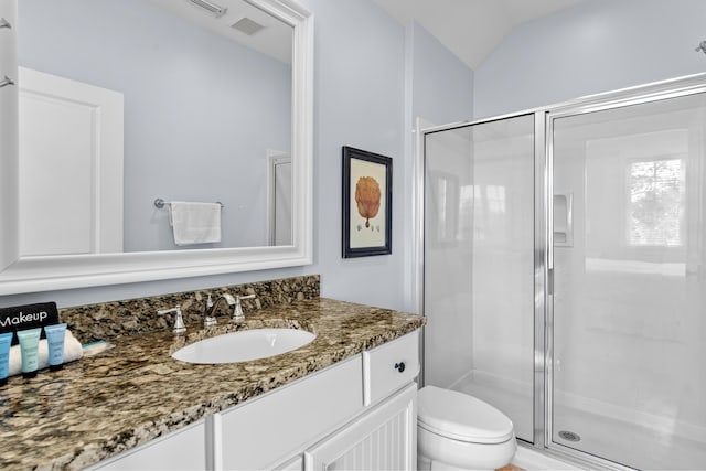2452 Bungalo Ln, Miramar Beach, FL 32550 - full bath with vanity, a shower stall, toilet, and vaulted ceiling
