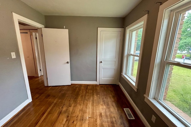 297 Anderson St, Crestview, FL 32536 - unfurnished bedroom with wood finished floors and baseboards