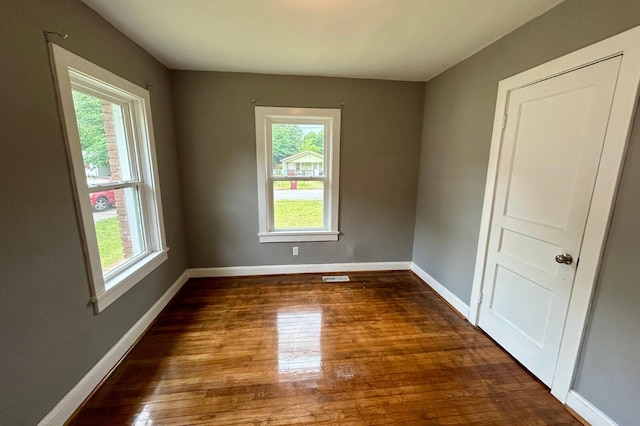 297 Anderson St, Crestview, FL 32536 - spare room with plenty of natural light, wood finished floors, and baseboards