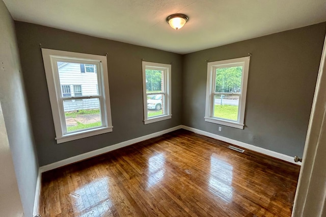 297 Anderson St, Crestview, FL 32536 - unfurnished room featuring dark wood finished floors and baseboards