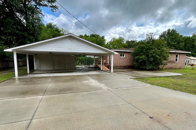 297 Anderson St, Crestview, FL 32536 - view of front of house featuring driveway and a carport