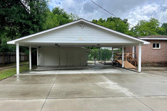 297 Anderson St, Crestview, FL 32536 - view of car parking with driveway, fence, and a carport
