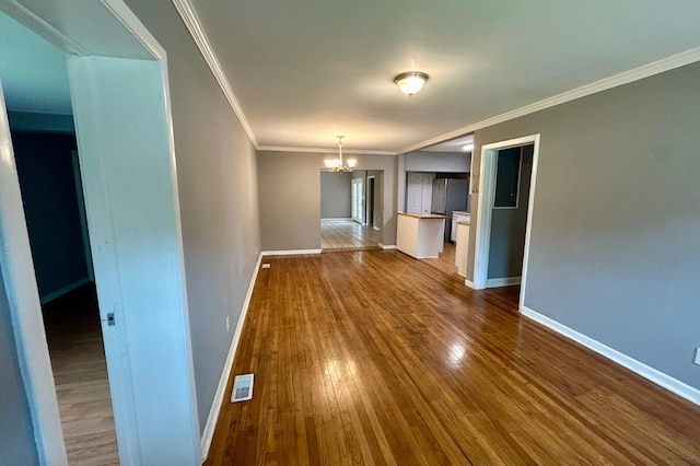 297 Anderson St, Crestview, FL 32536 - unfurnished dining area with a chandelier, dark wood finished floors, baseboards, and crown molding