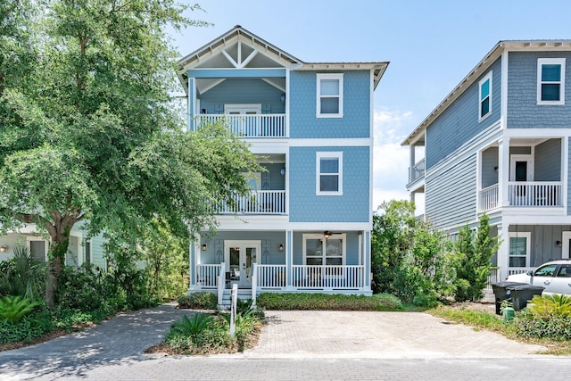 view of front of house with a balcony and covered porch