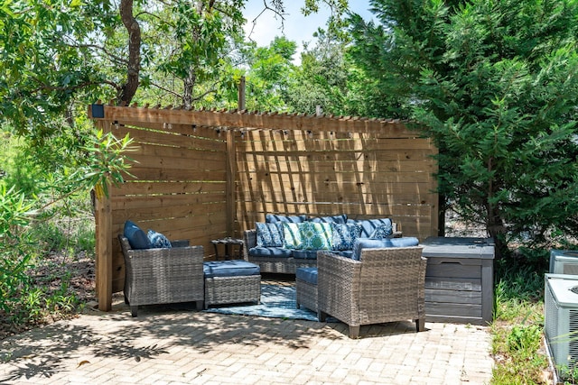 view of patio / terrace featuring an outdoor living space and central AC