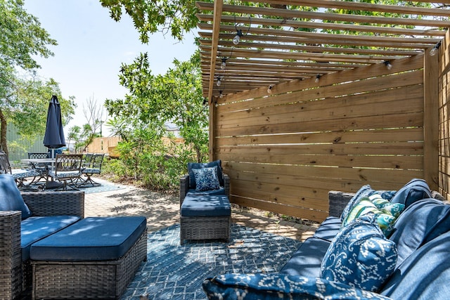 view of patio / terrace with a pergola and an outdoor living space