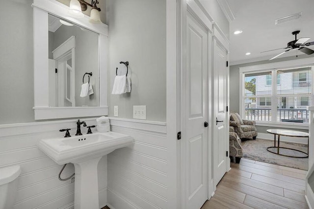 bathroom featuring wood-type flooring and ceiling fan