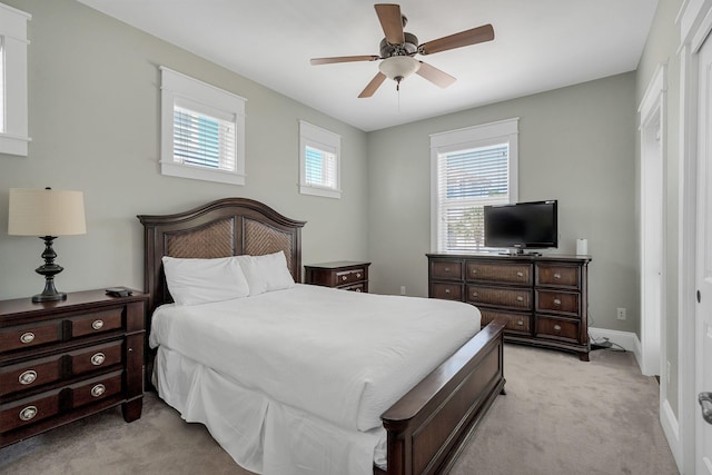 carpeted bedroom with a closet and ceiling fan