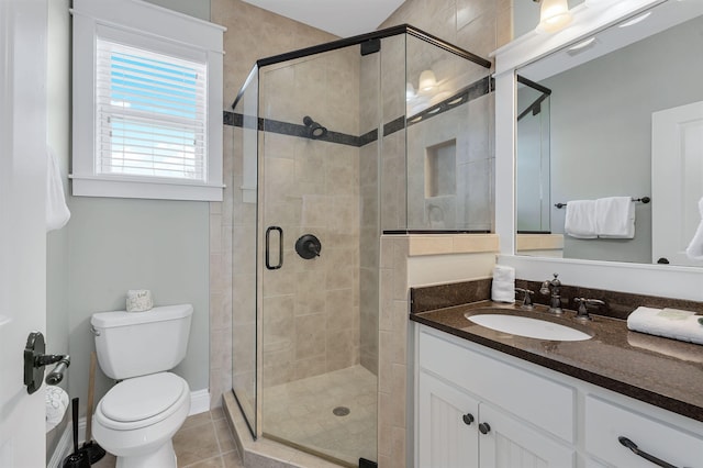 bathroom with toilet, an enclosed shower, vanity, and tile patterned flooring