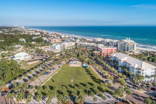 bird's eye view with a water view and a beach view