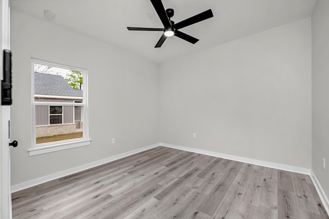 empty room featuring ceiling fan and light wood-type flooring