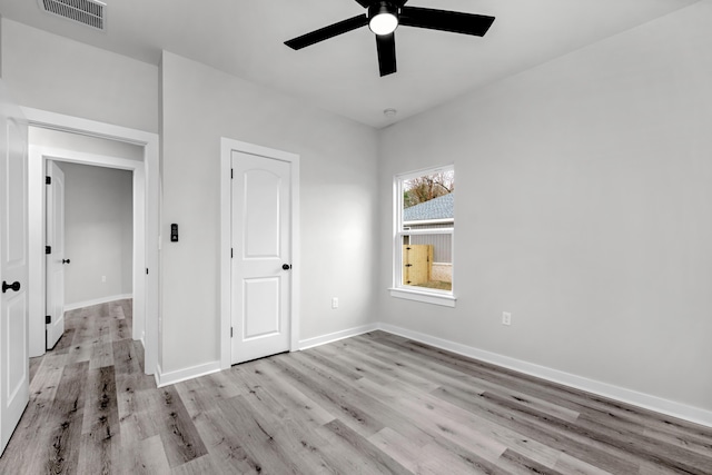 unfurnished bedroom featuring ceiling fan and light hardwood / wood-style flooring