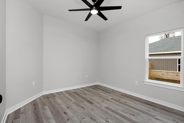 spare room featuring light wood-type flooring and ceiling fan