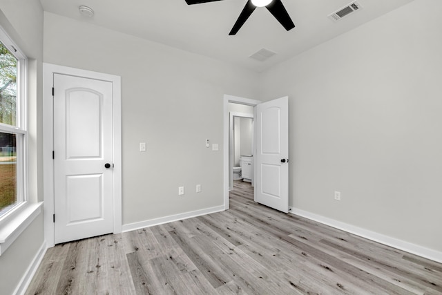 unfurnished bedroom featuring ceiling fan and light wood-type flooring