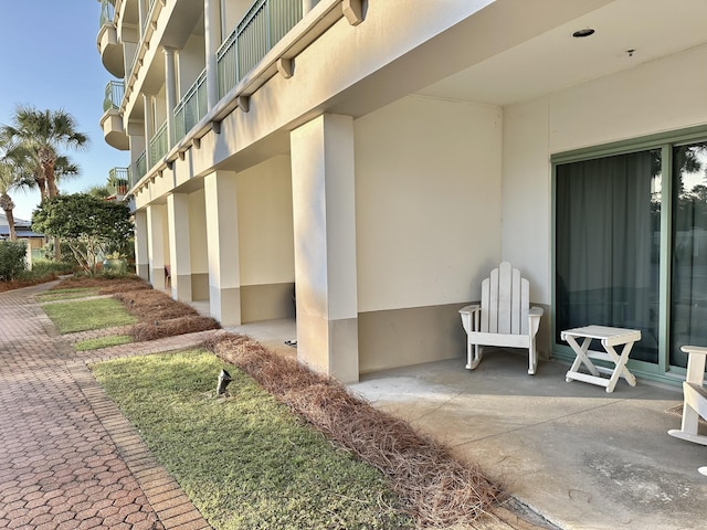 view of side of property featuring a balcony