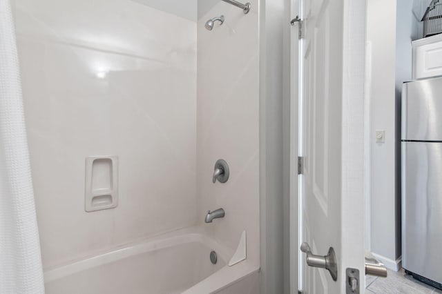 bathroom featuring shower / tub combo with curtain