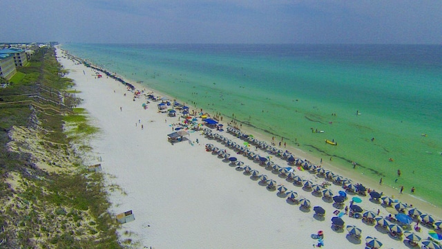 aerial view featuring a water view and a beach view