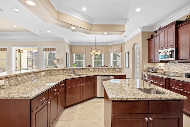 kitchen with ornamental molding, sink, and stainless steel appliances