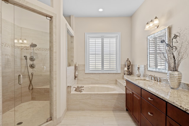 bathroom featuring vanity, tile patterned floors, separate shower and tub, and a wealth of natural light