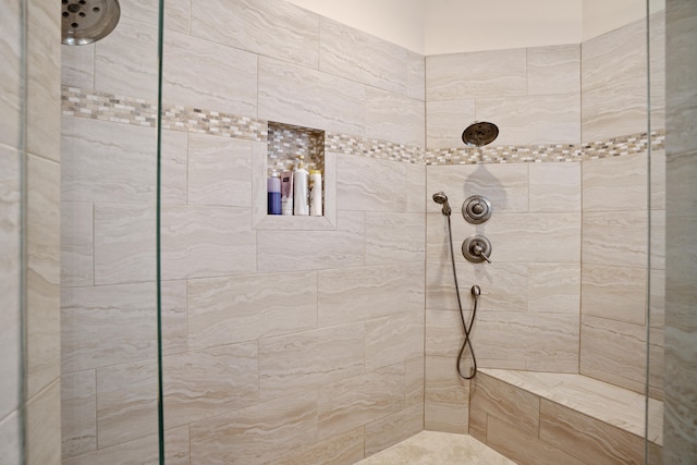 bathroom featuring tiled shower