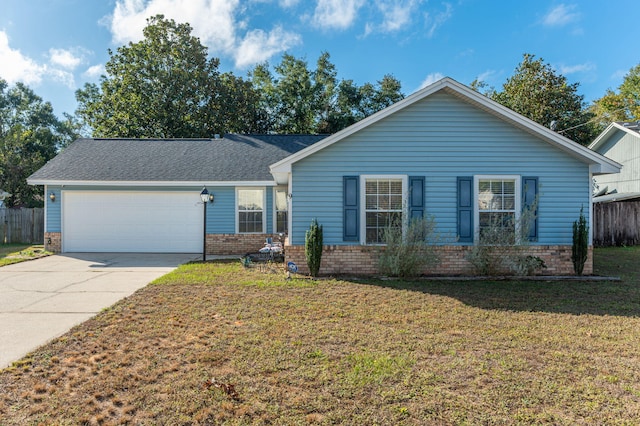 ranch-style home with a garage and a front lawn