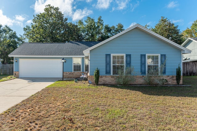 9 Holly Rd, Crestview, FL 32539 - ranch-style home featuring brick siding, fence, an attached garage, concrete driveway, and a front lawn