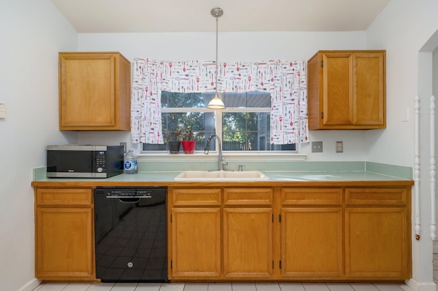 kitchen featuring light tile patterned flooring, sink, decorative light fixtures, and dishwasher