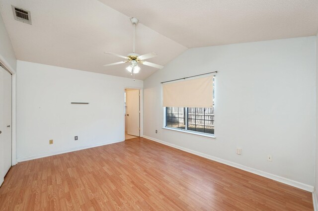 9 Holly Rd, Crestview, FL 32539 - unfurnished room featuring light wood finished floors, visible vents, baseboards, ceiling fan, and lofted ceiling