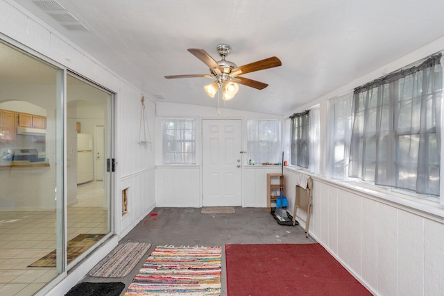 sunroom / solarium featuring lofted ceiling and ceiling fan