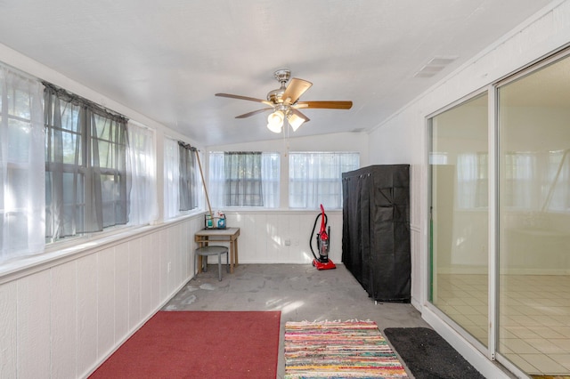 sunroom with vaulted ceiling and ceiling fan