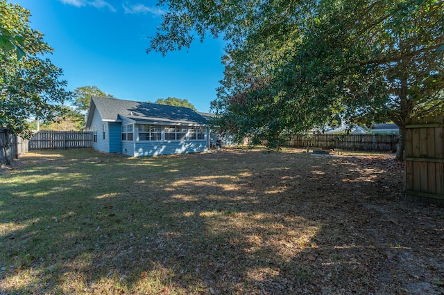 view of yard featuring a sunroom