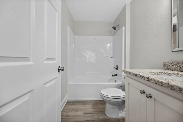 full bathroom with vanity, wood-type flooring, shower / bathing tub combination, and toilet