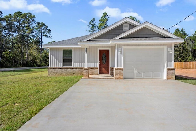 view of front facade with a front yard and a garage