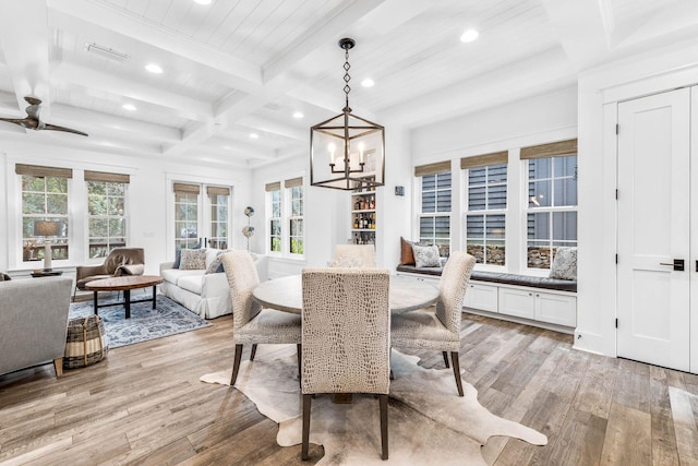 79 Cedar Post Rd, Santa Rosa Beach, FL 32459 - dining space featuring beamed ceiling, ceiling fan with notable chandelier, coffered ceiling, and light hardwood / wood-style flooring