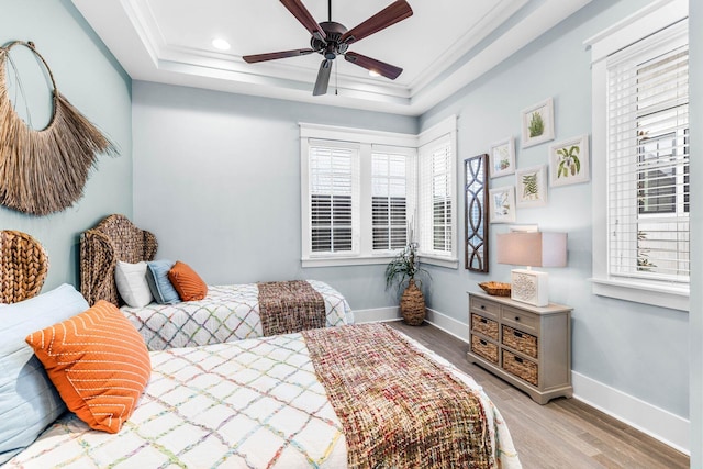 79 Cedar Post Rd, Santa Rosa Beach, FL 32459 - bedroom with ceiling fan, a raised ceiling, light wood-type flooring, and ornamental molding