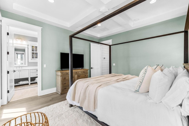 79 Cedar Post Rd, Santa Rosa Beach, FL 32459 - bedroom with beamed ceiling, ensuite bathroom, light wood-type flooring, and coffered ceiling