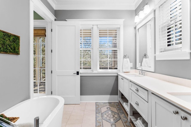 79 Cedar Post Rd, Santa Rosa Beach, FL 32459 - bathroom featuring a bathing tub, vanity, ornamental molding, and tile patterned flooring