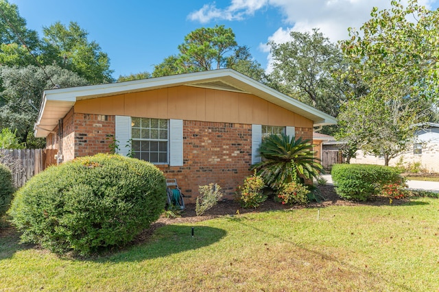 view of home's exterior with a yard