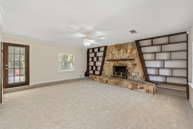 813 Linden Ave, Niceville, FL 32578 - unfurnished living room with carpet, crown molding, a stone fireplace, baseboards, and attic access
