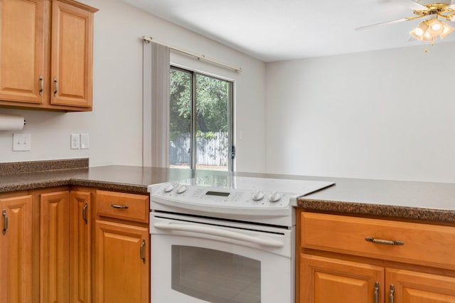 kitchen with white electric range and ceiling fan