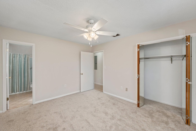 813 Linden Ave, Niceville, FL 32578 - unfurnished bedroom with carpet floors, a closet, baseboards, electric panel, and ensuite bathroom