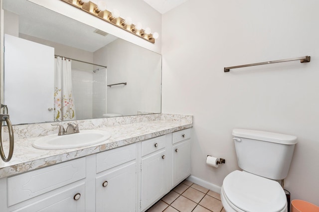 bathroom with vanity, a shower with curtain, toilet, and tile patterned flooring